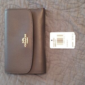 Excellent condition COACH leather navy trifold wallet